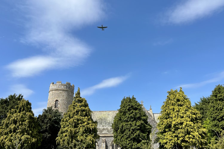 Spitfire fly-past at North Norfolk church