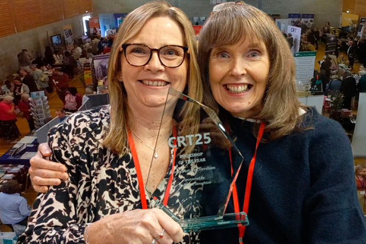 Irene and Helen holding the award